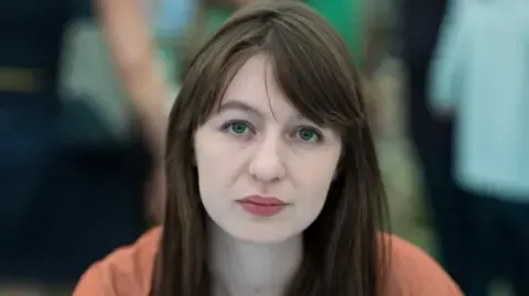 Sally Rooney claims she will not travel to the UK due to arrest fears