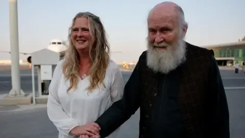 Son of UK Pair Held by Militant Group ‘Ecstatic’ as They Return to UK